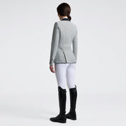 Angled back view of a female model wearing the gray Cavalleria Toscana GP Perforated Riding Jacket on a plain background