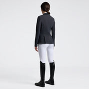 Cavalleria Toscana zip competition jacket in charcoal, back view, worn with white breeches and tall black riding boots