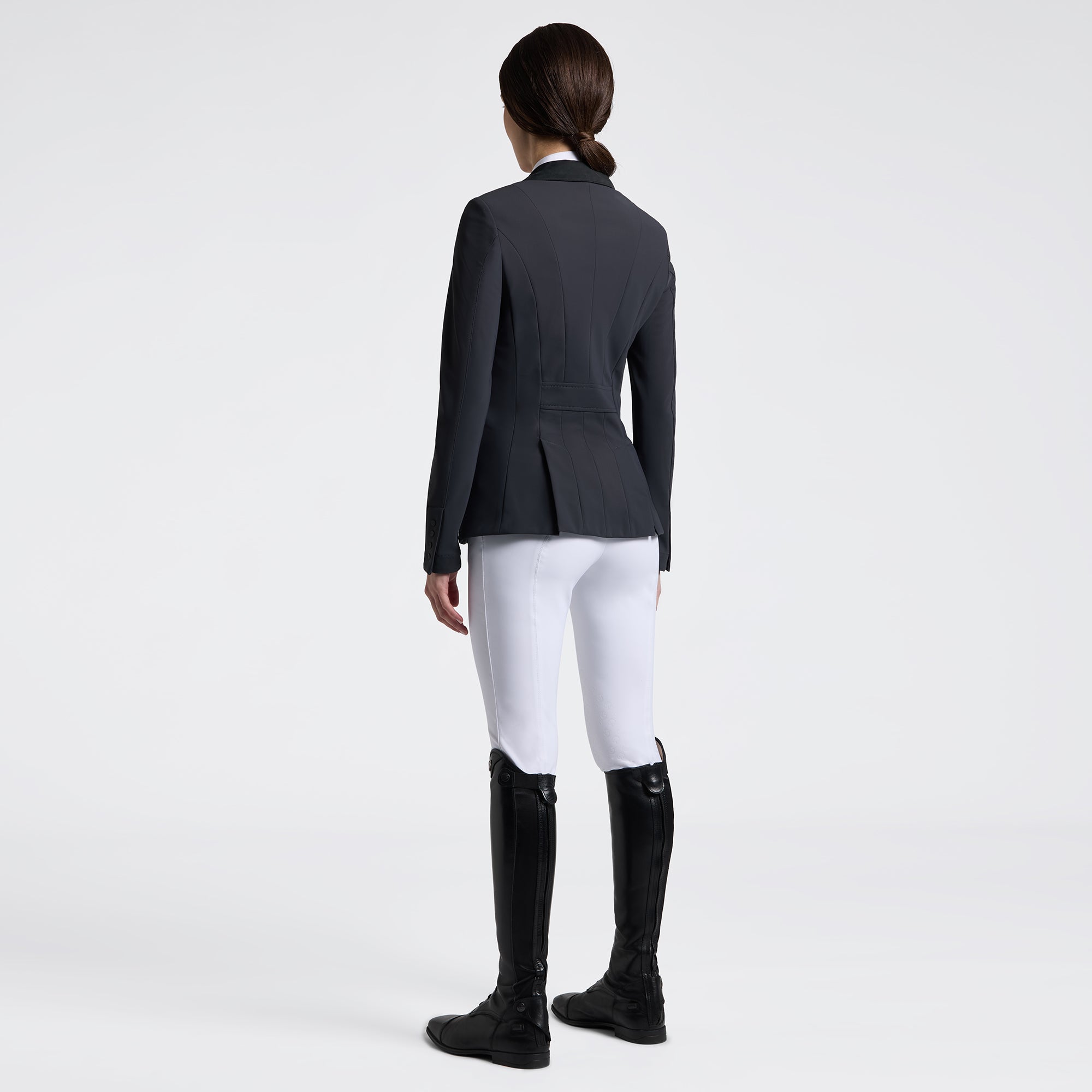 Cavalleria Toscana zip competition jacket in charcoal, back view, worn with white breeches and tall black riding boots