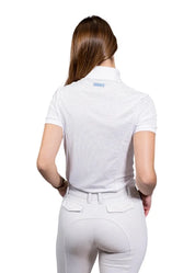 Woman wearing a white equestrian shirt and pants on a white background