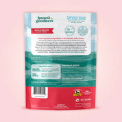 Back view of a bag of the apple flavored Honest to Goodness Upcycled Horse Treats on a pink background