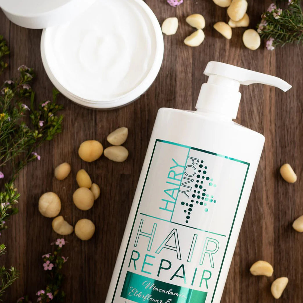 Flat lay front view of a bottle of Hairy Pony Hair Repair in Macadamia, Elderflower, & Jojoba
