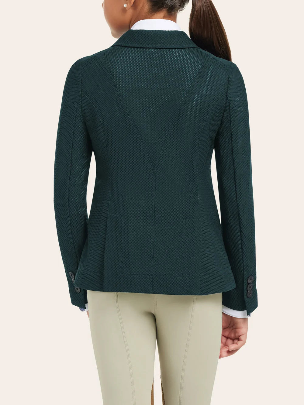 Back view of the RJ Classics Harmony Jr. 2.0 Mesh Show Coat in Green Gables showing textured mesh fabric, a fitted back shape with seam lines, and buttoned cuffs, worn over a white show shirt with tan breeches against a plain light background.