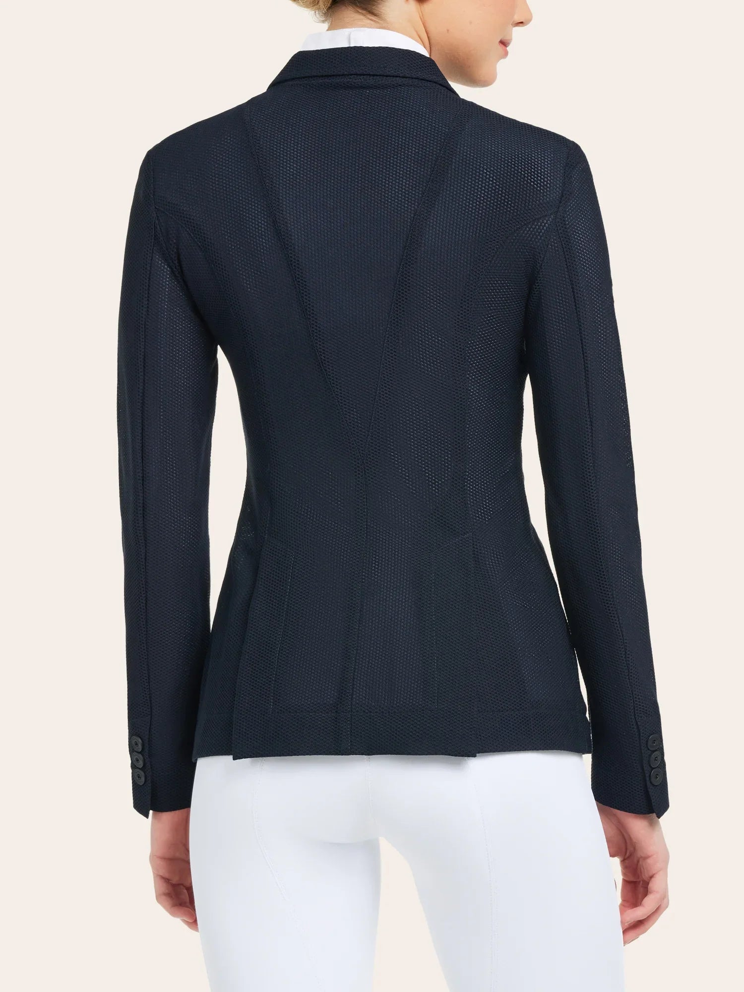 Back view of a female model wearing the navy RJ Classics Harmony Mesh Coat on a white background