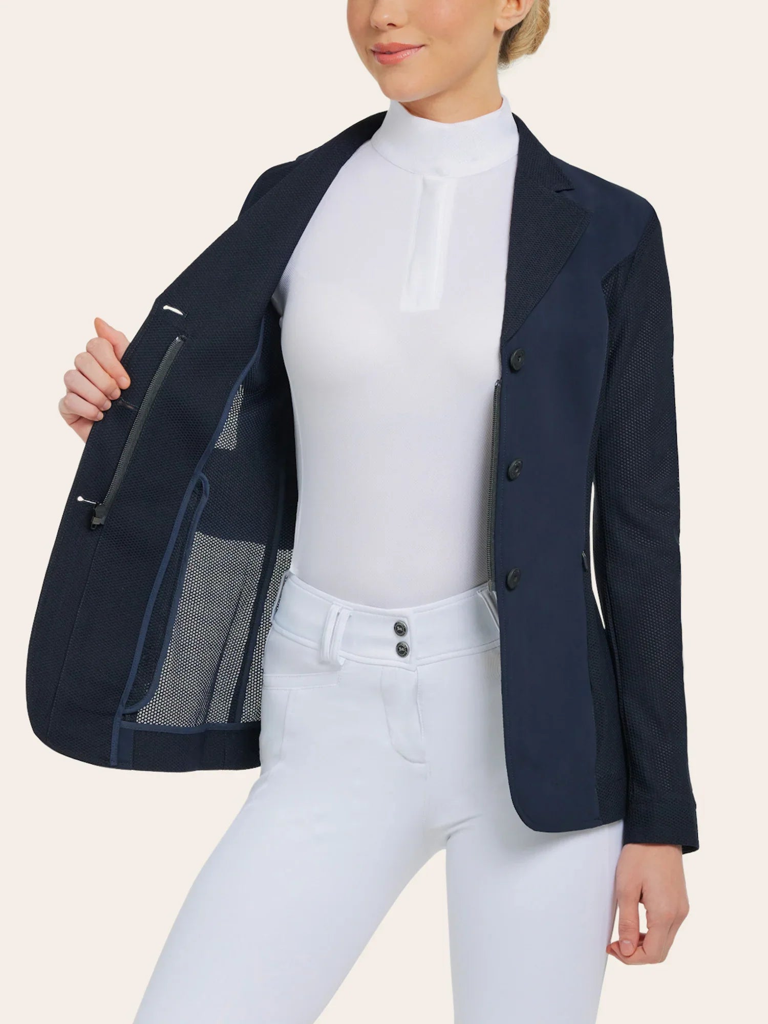 Front view of a female model wearing the navy RJ Classics Harmony Mesh Coat and showing the mesh feature