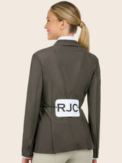 Back view of a model wearing the taupe RJ Classics Harmony Evo Mesh Show Coat with an RJC placard attached on a plain background