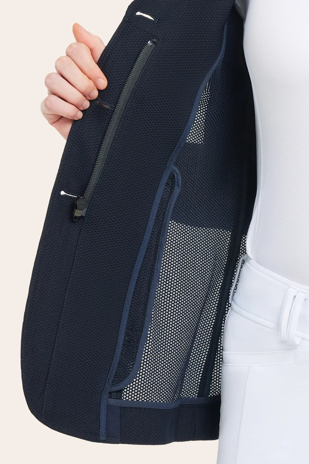 Close-up of navy Harmony Jr. 2.0 Mesh Show Coat showing interior mesh lining