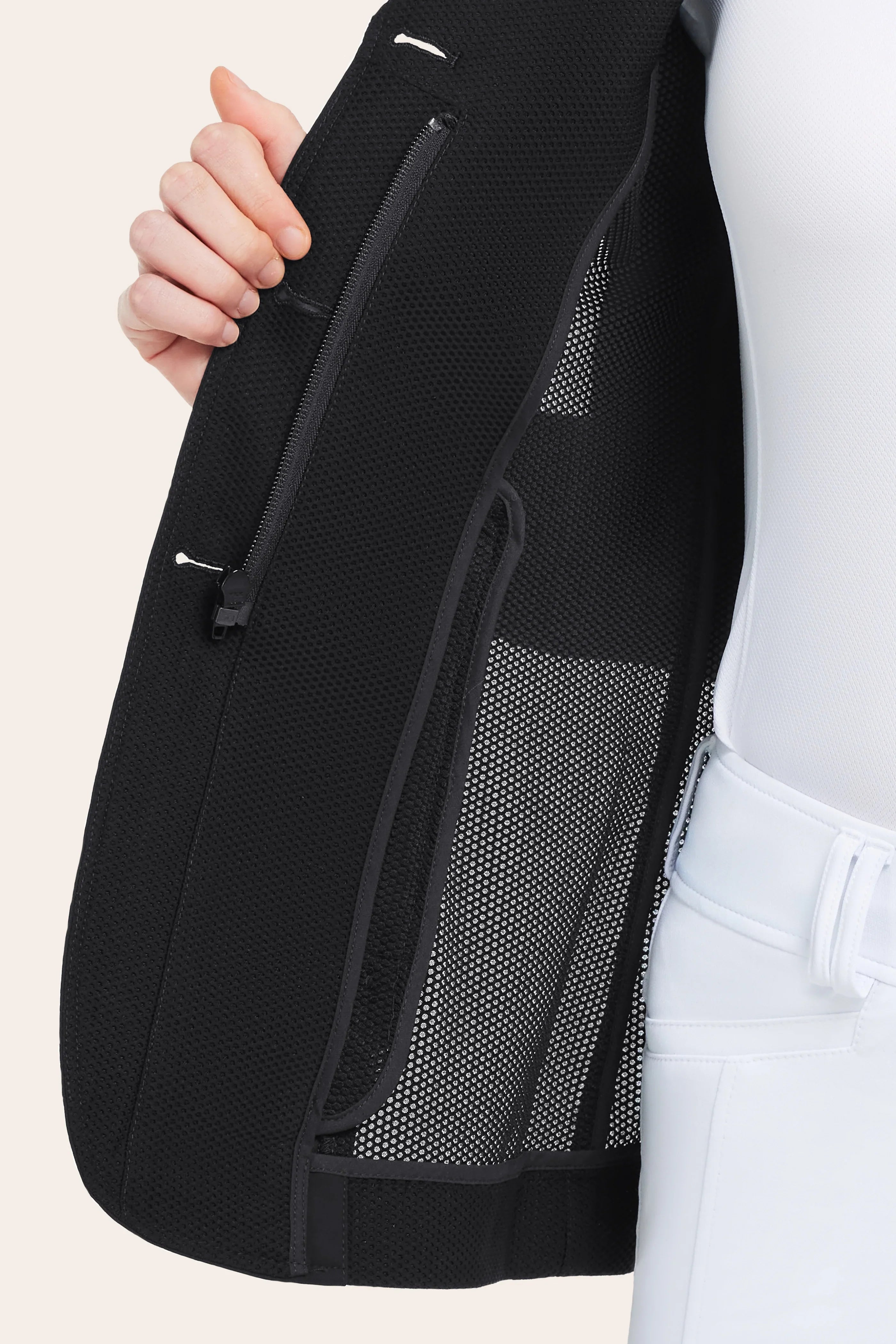 Close-up view of the mesh on the black RJ Classics Harmony Mesh Coat on a white background