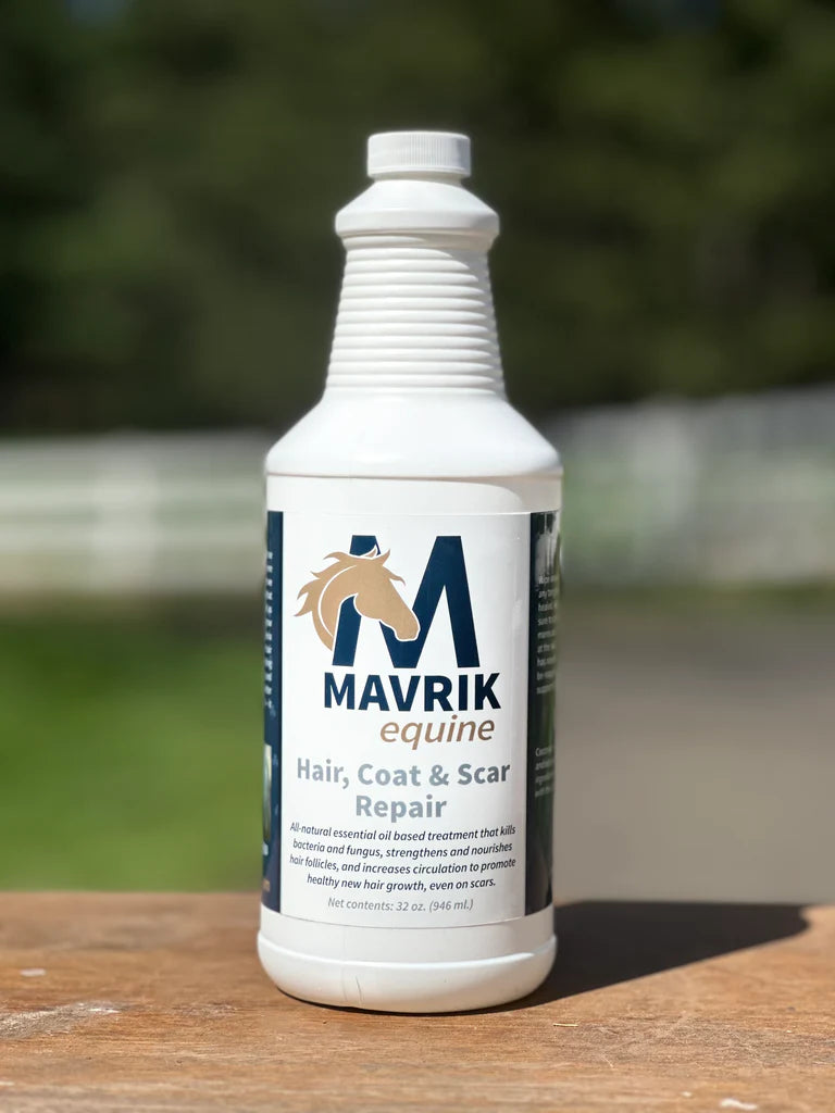 Front view of a 32 oz refill bottle of Mavrik Equine Hair, Coat & Scar Repair on a fence outside