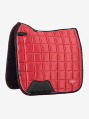 Side view of the cranberry LeMieux Loire Classic Dressage Square on a white background