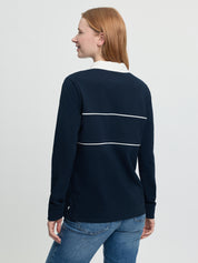 Back view of navy Rochelle Rugby Shirt showing white collar and horizontal white piping.