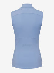 Back view of the LeMieux Airflow sleeveless base layer in powder blue showing a high collar, curved seam panels, and a small perforated section at mid-back on a white background.