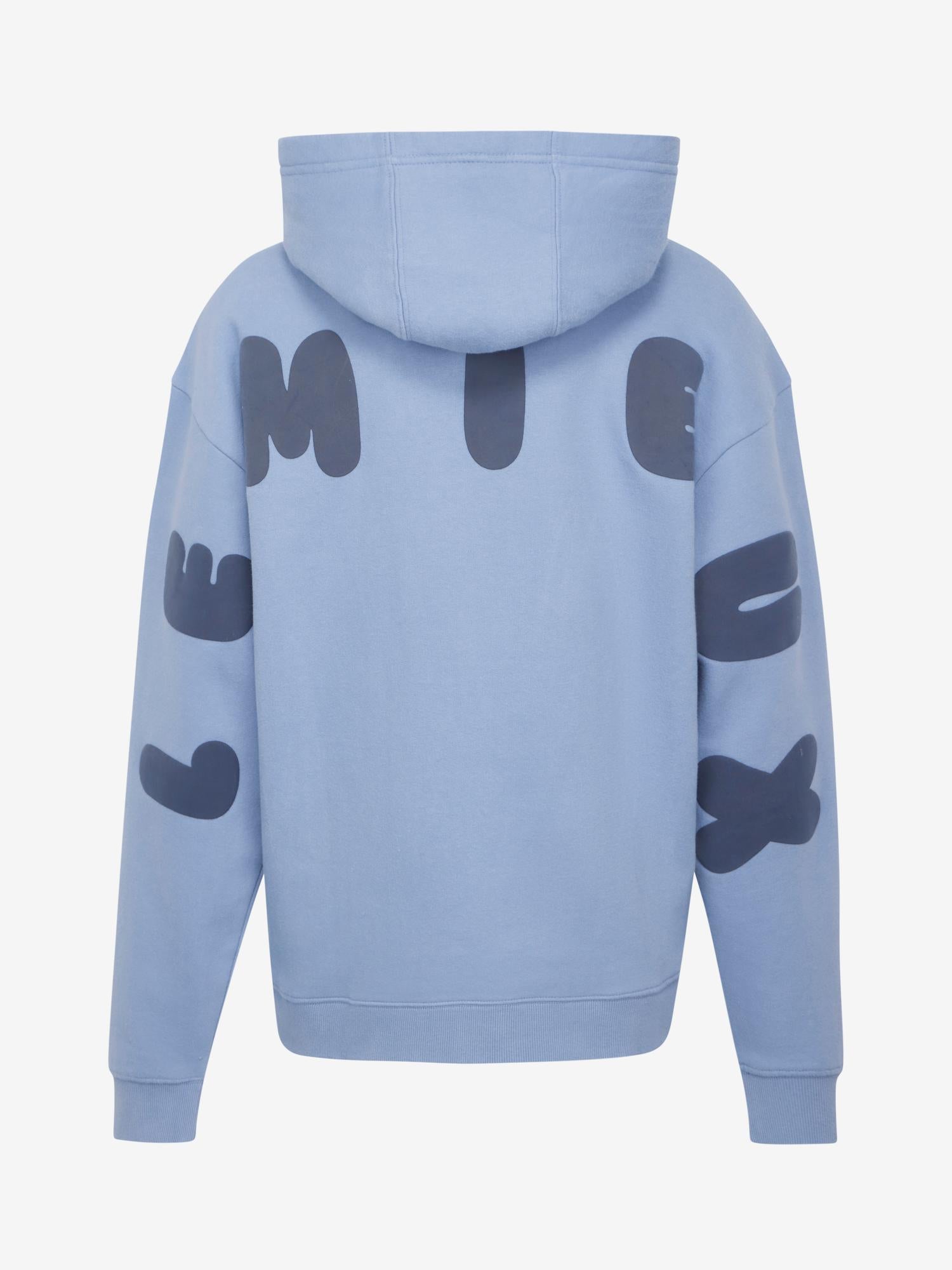 Back view of LeMieux Young Rider Sia Hoodie in powder blue with oversized LeMieux lettering on sleeves and back