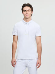 Model wearing LeMieux men’s short sleeve competition shirt in white with button collar and quarter placket