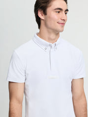 Model wearing LeMieux men’s short sleeve competition shirt in white with button collar and quarter placket, side view