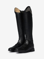 Angled view of a pair of LeMieux Junior Interchangeable Riding Boots in Black with laces on the front of the ankle