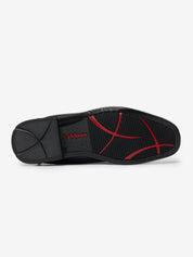 Bottom view of the black and red sole pattern of a LeMieux Junior Interchangeable Riding Boot