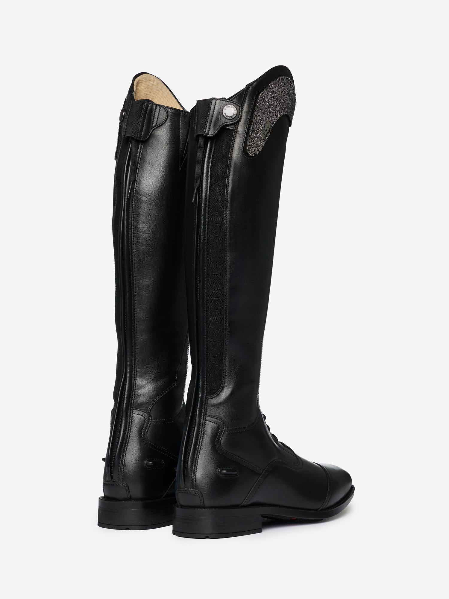 Back view of a pair of LeMieux Junior Interchangeable Riding Boots showing the zipper and gusset along the backside of the boot.