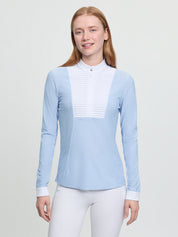 Model wearing LeMieux Arielle Long Sleeve Show Shirt in Mist with white stand collar and pleated bib front