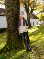 Slightly angled front view of a model wearing Wild Rose LeMieux Phoebe Half Zip Waterproof Anorak