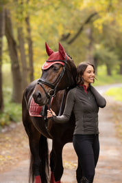 Angled front view of a model wearing Cocoa LeMieux Maddie Jacket