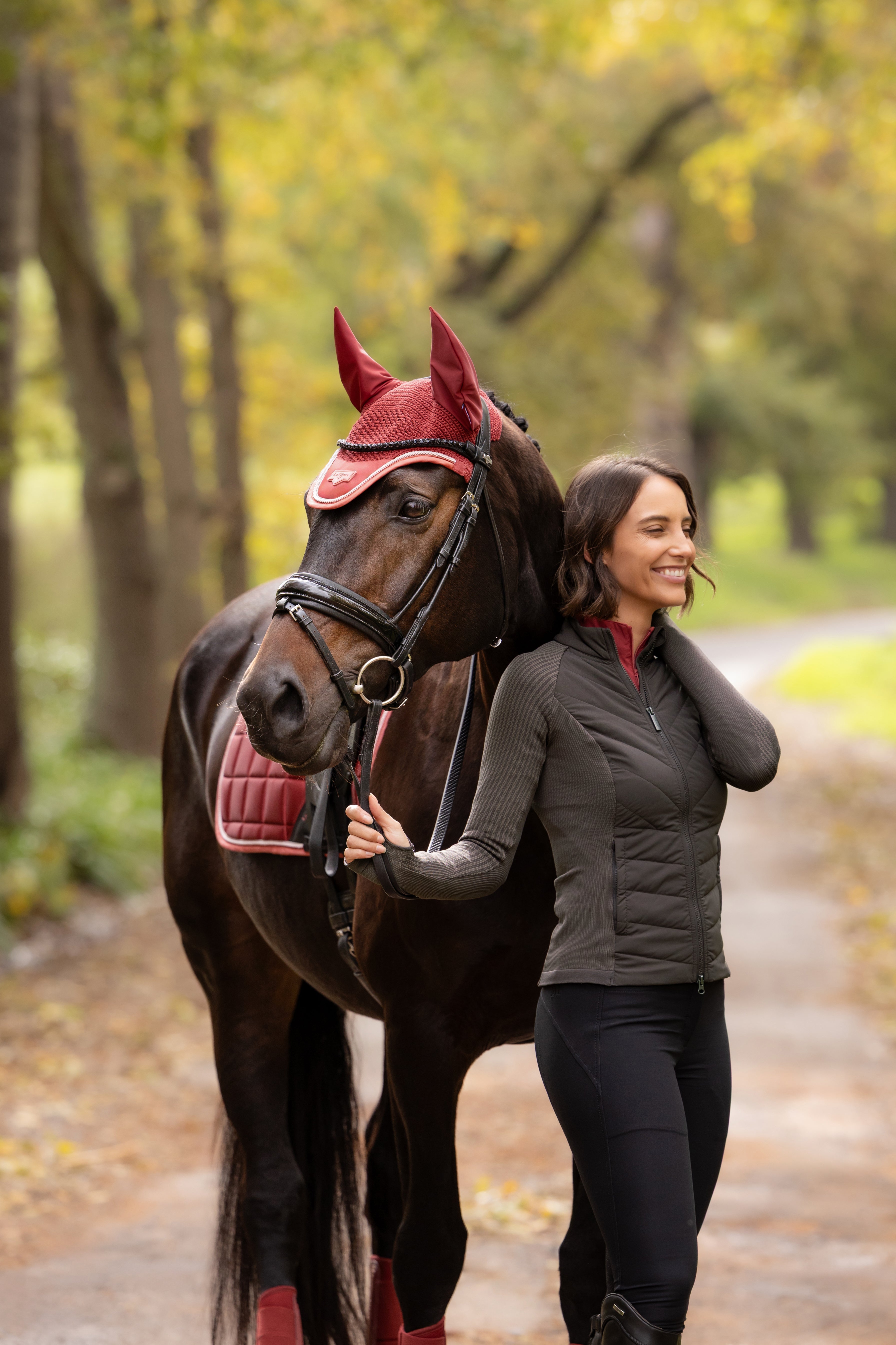 Angled front view of a model wearing Cocoa LeMieux Maddie Jacket
