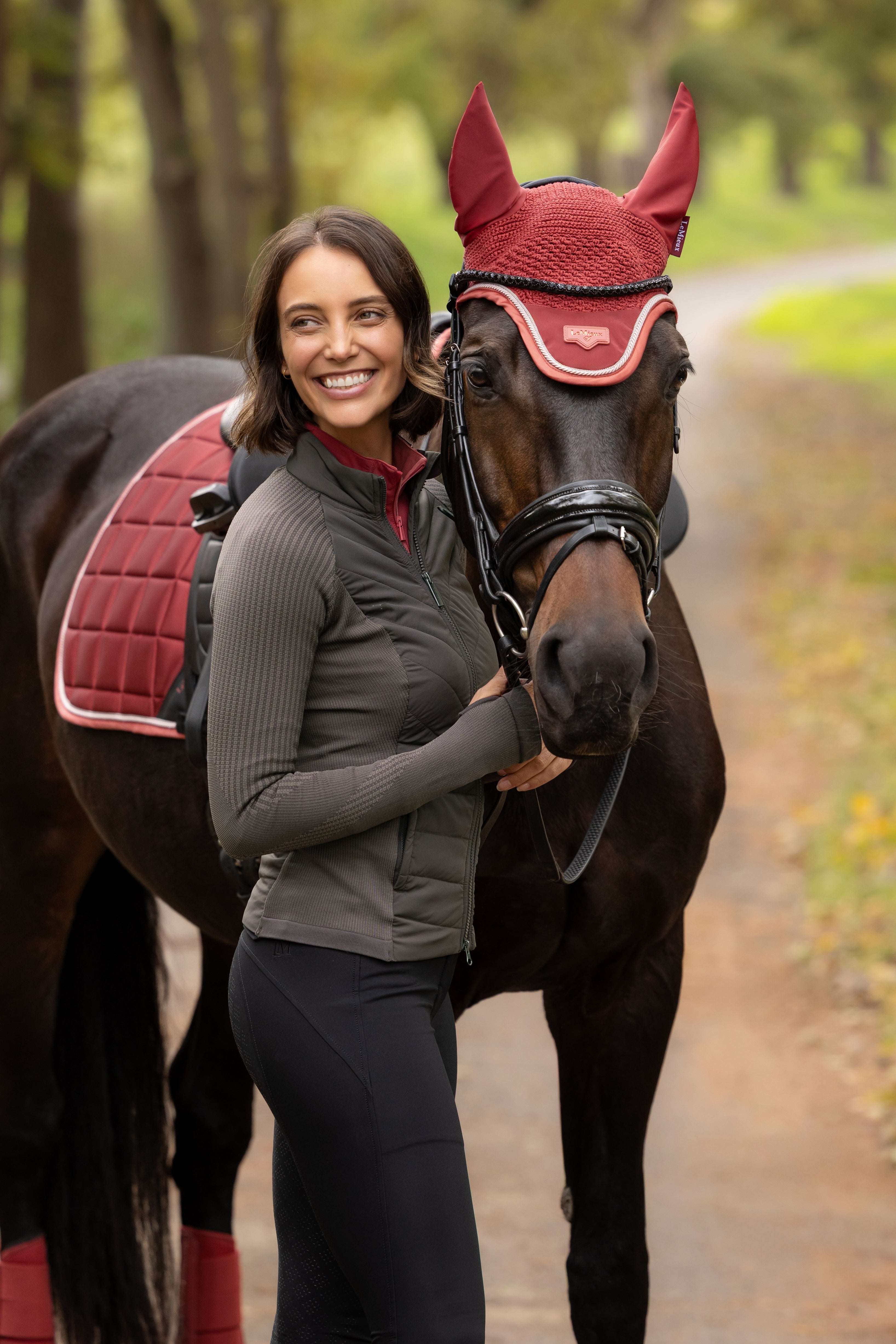 Angled side view of a model wearing Cocoa LeMieux Maddie Jacket