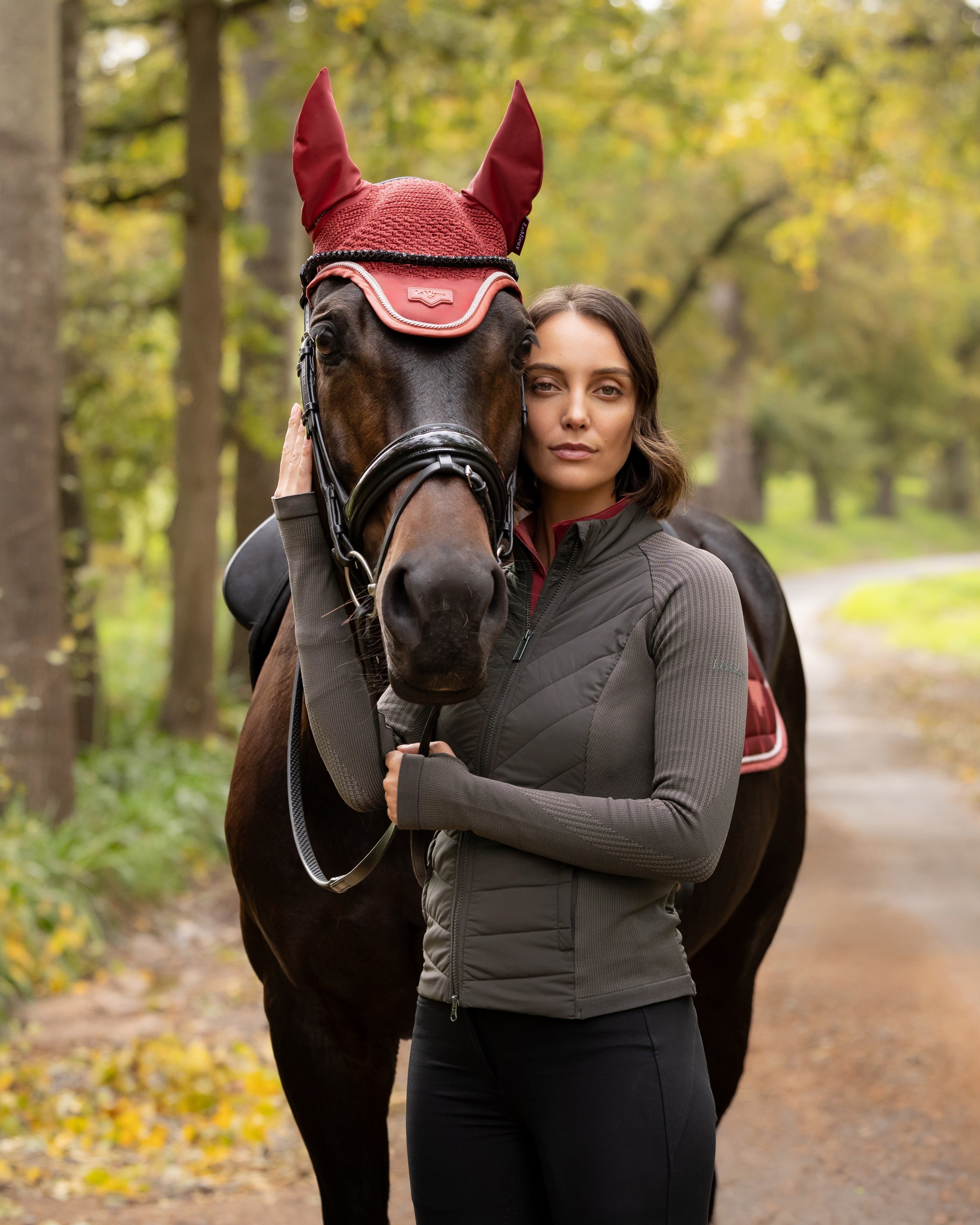 Angled front view of a model wearing Cocoa LeMieux Maddie Jacket