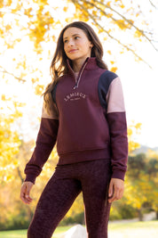 Front view of a young female model wearing Bramble LeMieux Young Rider Viola Quarter Zip Sweatshirt outdoors
