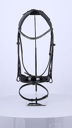 GIF of a Schockemohle Isabell Werth Satchmo Dressage Bridle on a rotating platform on a plain background