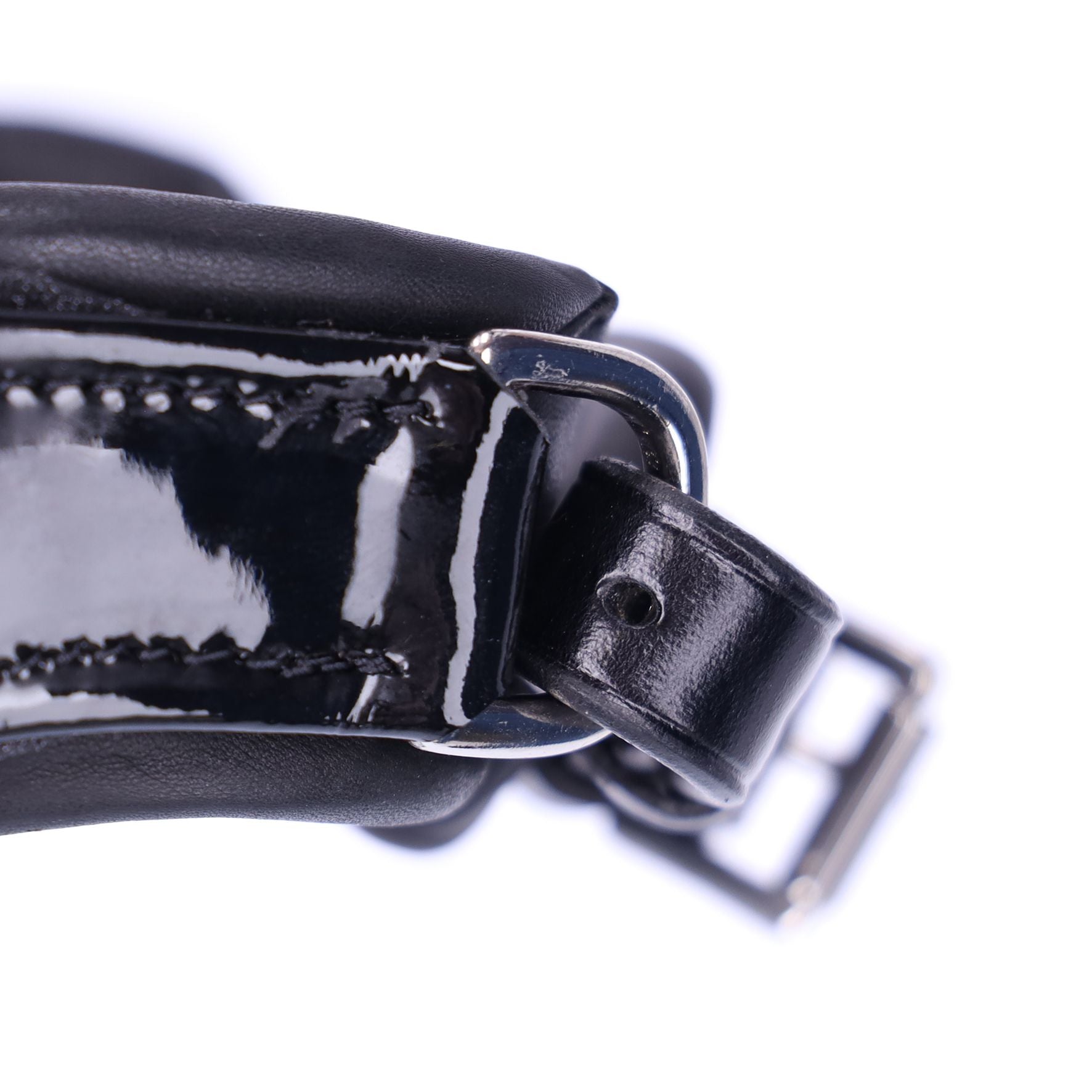 Close-up view of the adjustable chin strap on the Schockemohle Isabell Werth Bella Rose Dressage Bridle on a white background
