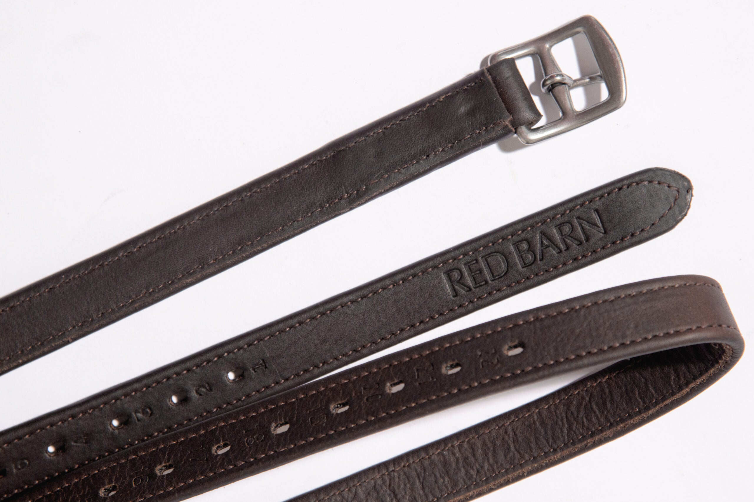 View of the brown Red Barn Geta' Grip Calf Lined Leathers on a plain background