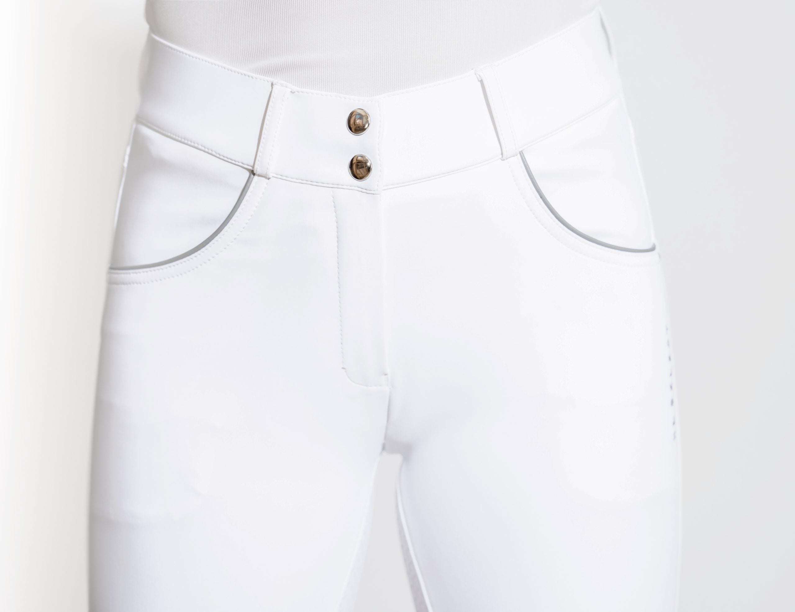 Close-up front view of a model wearing the white KL Select Gabrielle Breech on a white background
