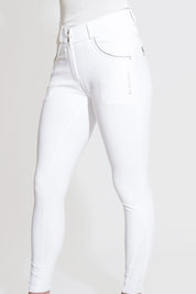 Side view of a model wearing the white KL Select Gabrielle Full Seat Breech on a white background