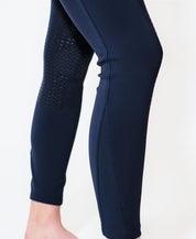 Close-up side view of the lowe leg on the navy KL Select Gabrielle Knee Patch Breech on a plain background