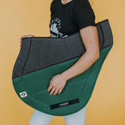 Side view of the green Ecogold Secure Cross Country Pad on a yellow background