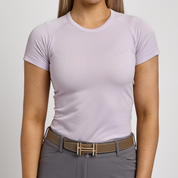 Front view of a female model wearing the Charm TKEQ Kennedy Seamless Short Sleeve Shirt 2.0 on a white background