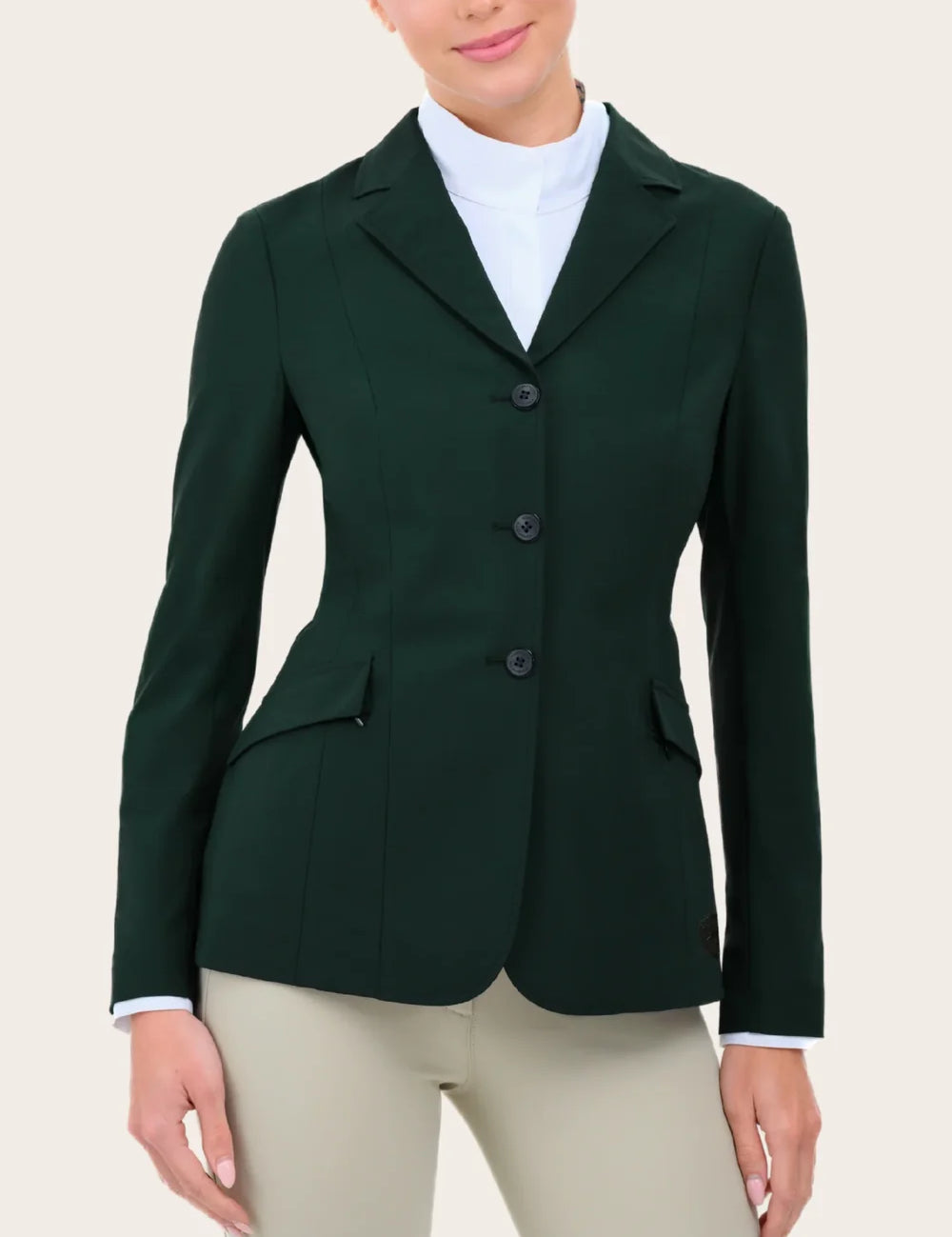 Close-up front view of a female model wearing the green RJ Classics Legacy Lite Show Coat on a plain background