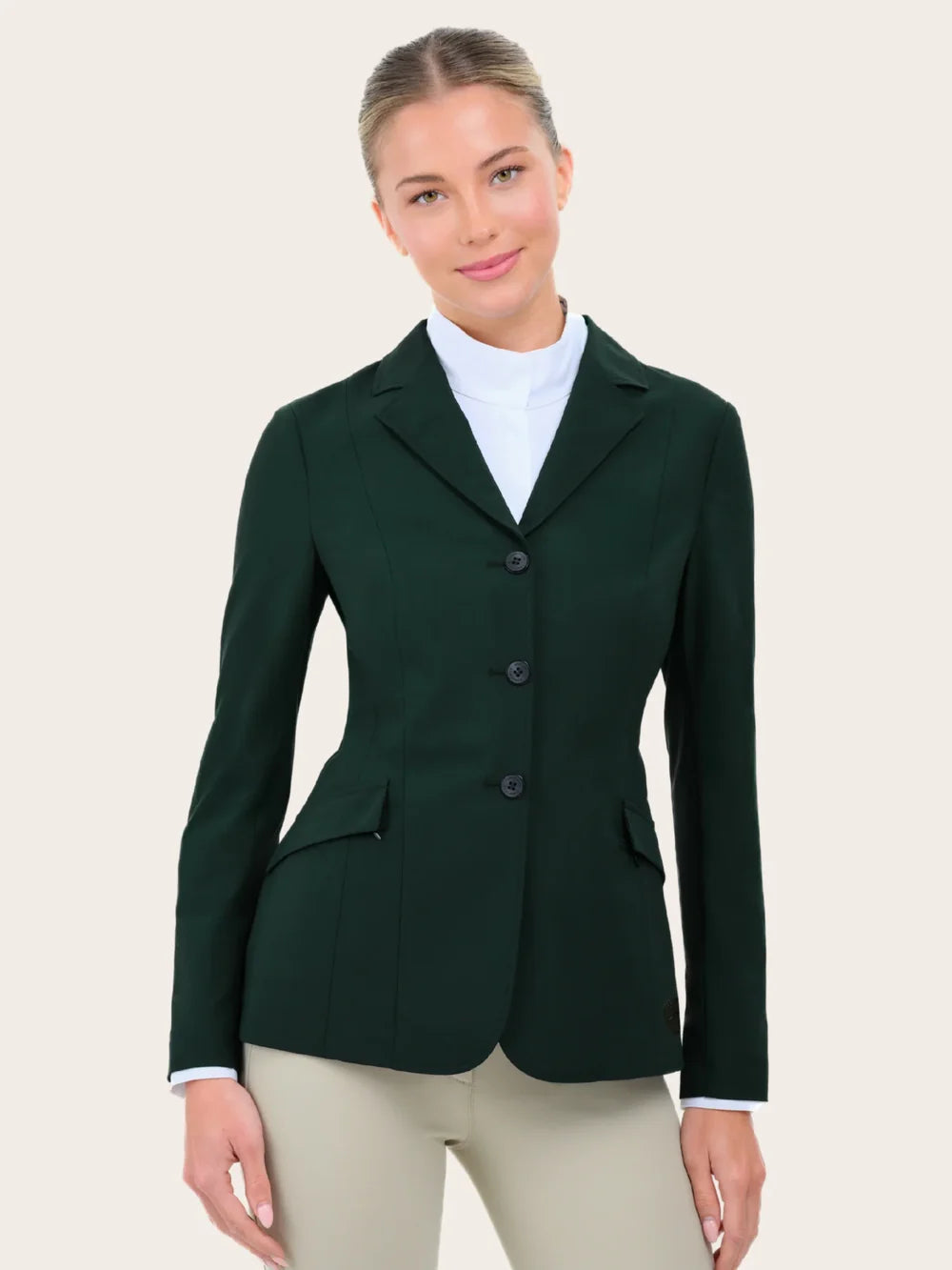 Front view of a female model wearing the green RJ Classics Legacy Lite Show Coat on a plain background