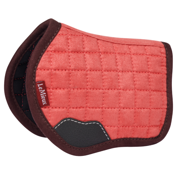 Side view of the cranberry LeMieux Toy Pony Saddle Pad on a white background