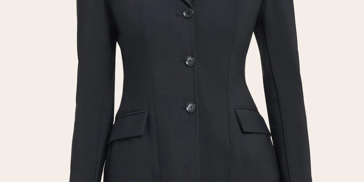 Front view of a model wearing the black RJ Classics Monterey Show Coat on a plain background