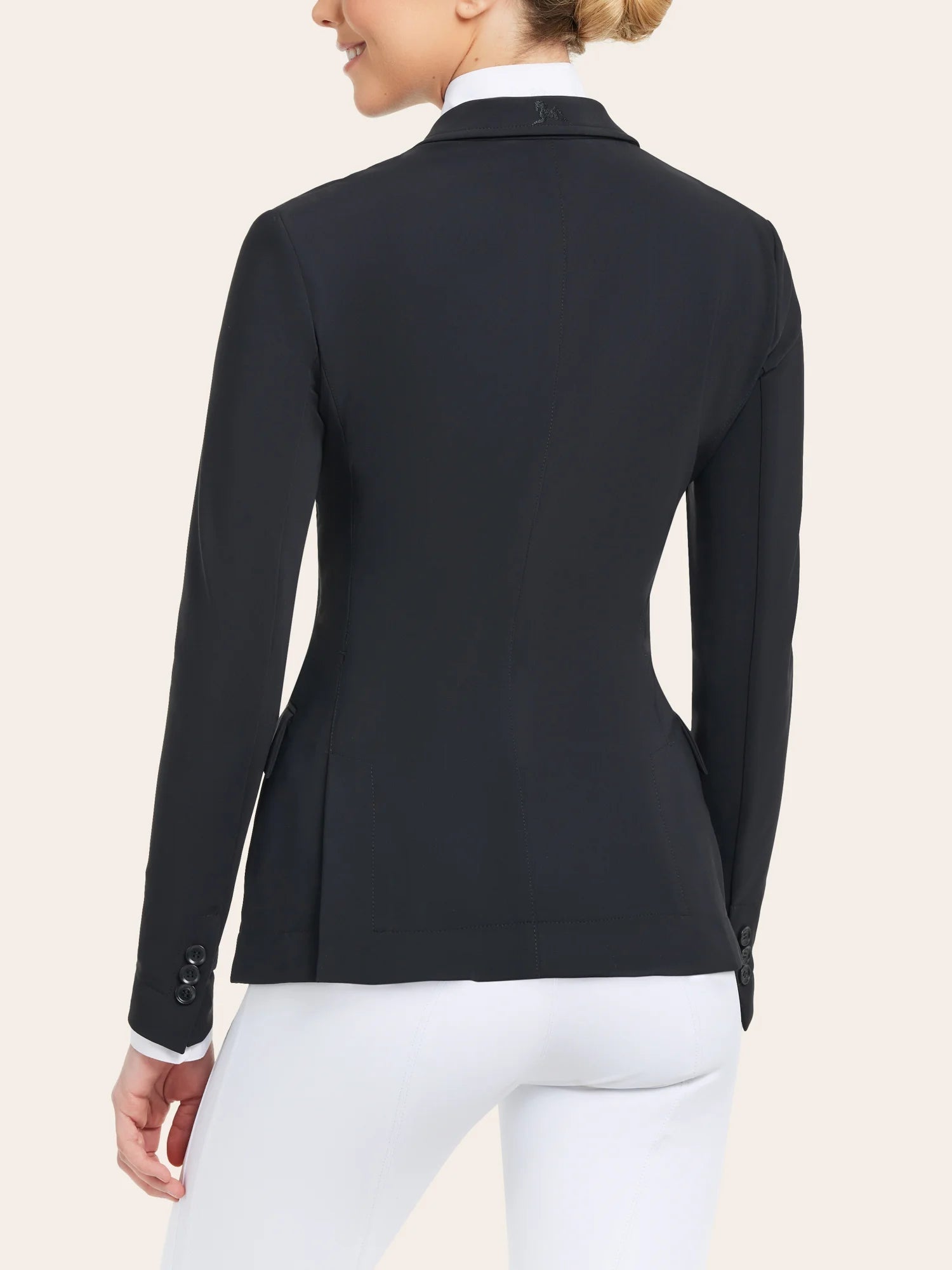Back view of a model wearing the black RJ Classics Monterey Show Coat on a plain background
