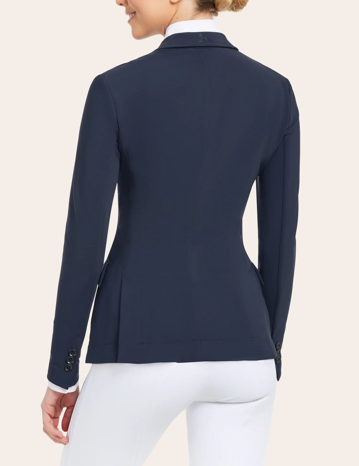 Back view of a model wearing the navy RJ Classics Monterey Show Coat on a plain background