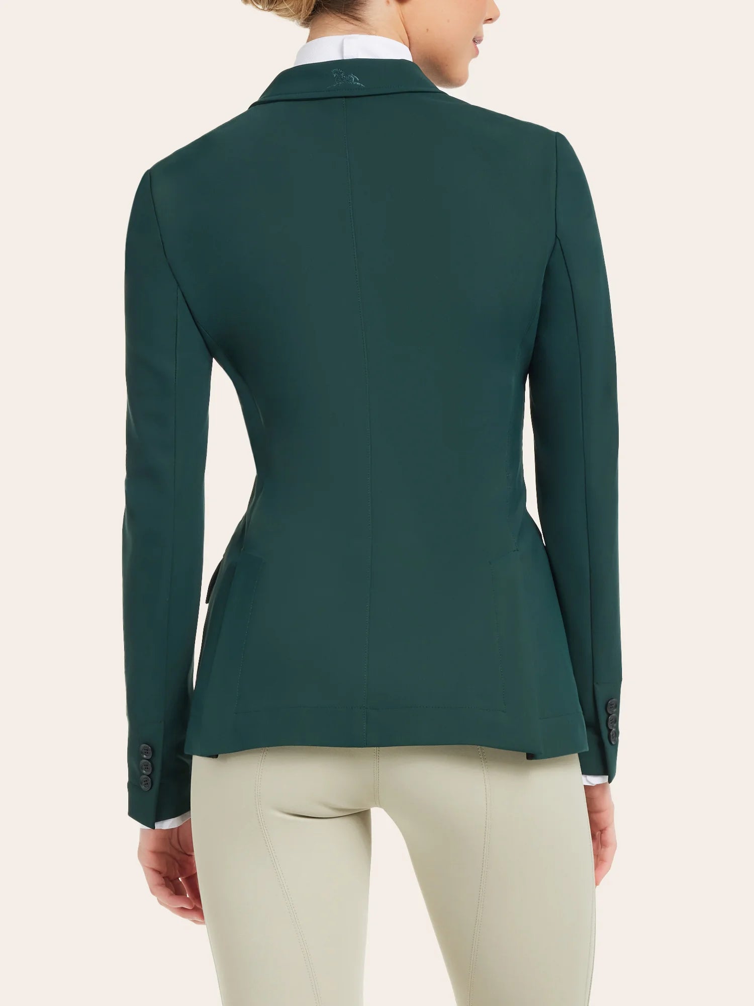 Back view of a model wearing the pine RJ Classics Monterey Show Coat on a plain background