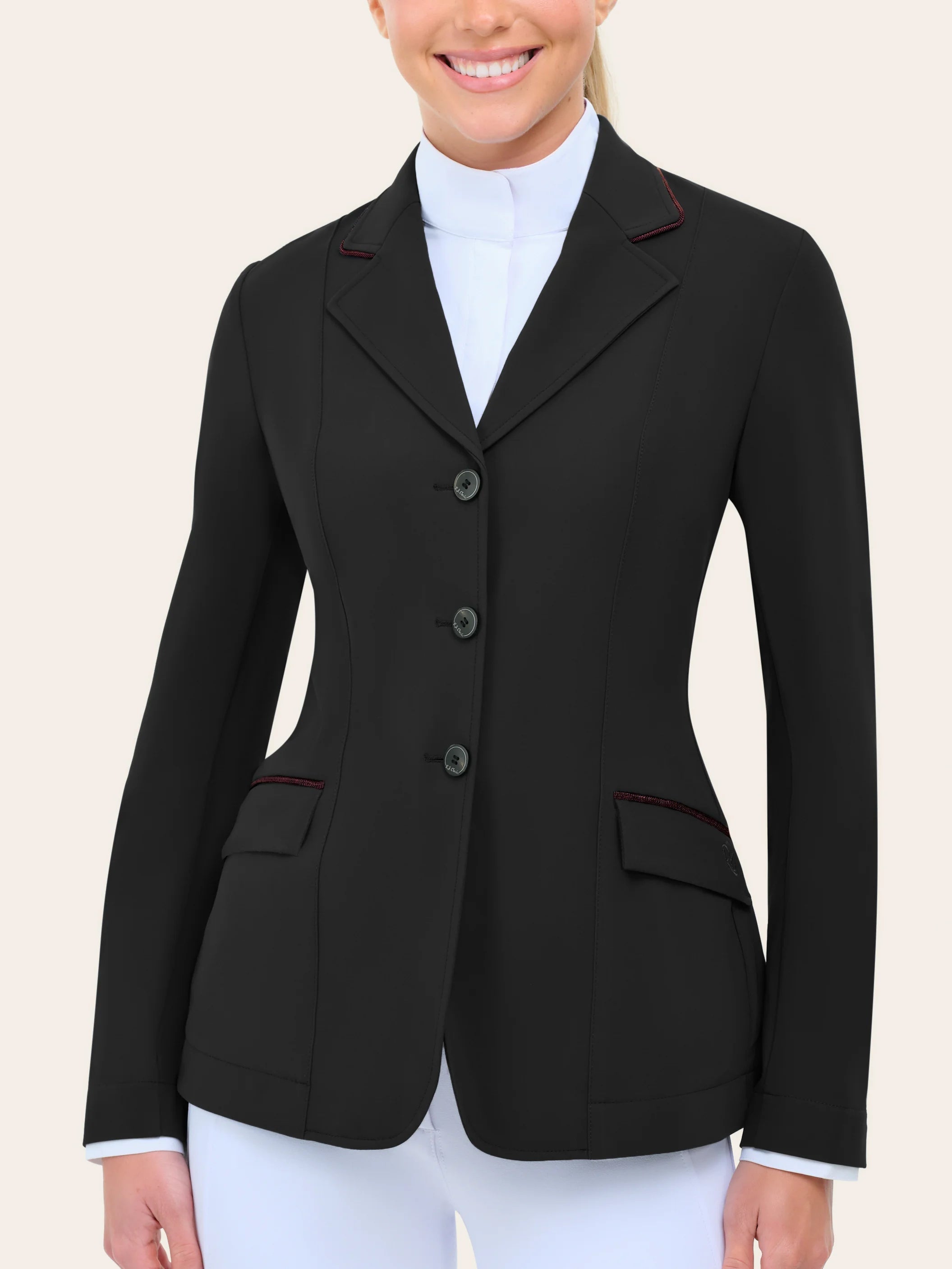 Front view of a model wearing the black with burgundy piping  RJ Classics Monterey Show Coat on a plain background