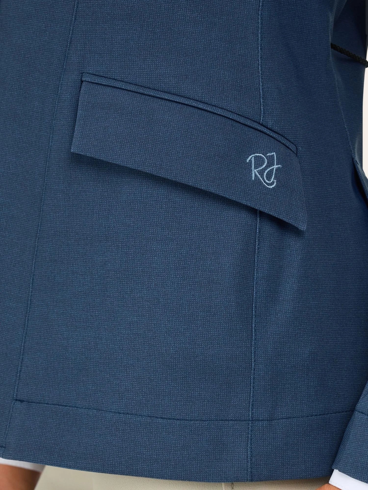 Close-up view of a pocket on the blue weave RJ Classics Monterey Show Coat