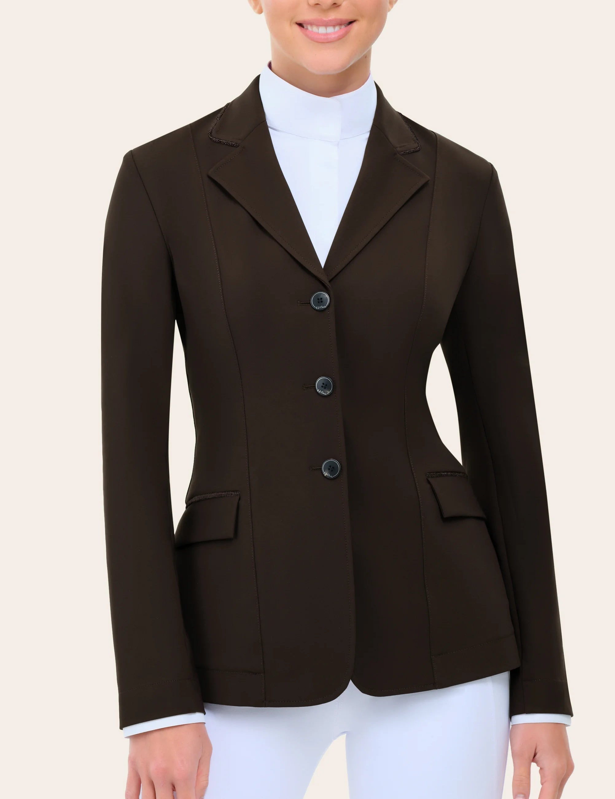 Front view of a female model wearing the chocolate RJ Classics Monterey Show Coat on a plain background
