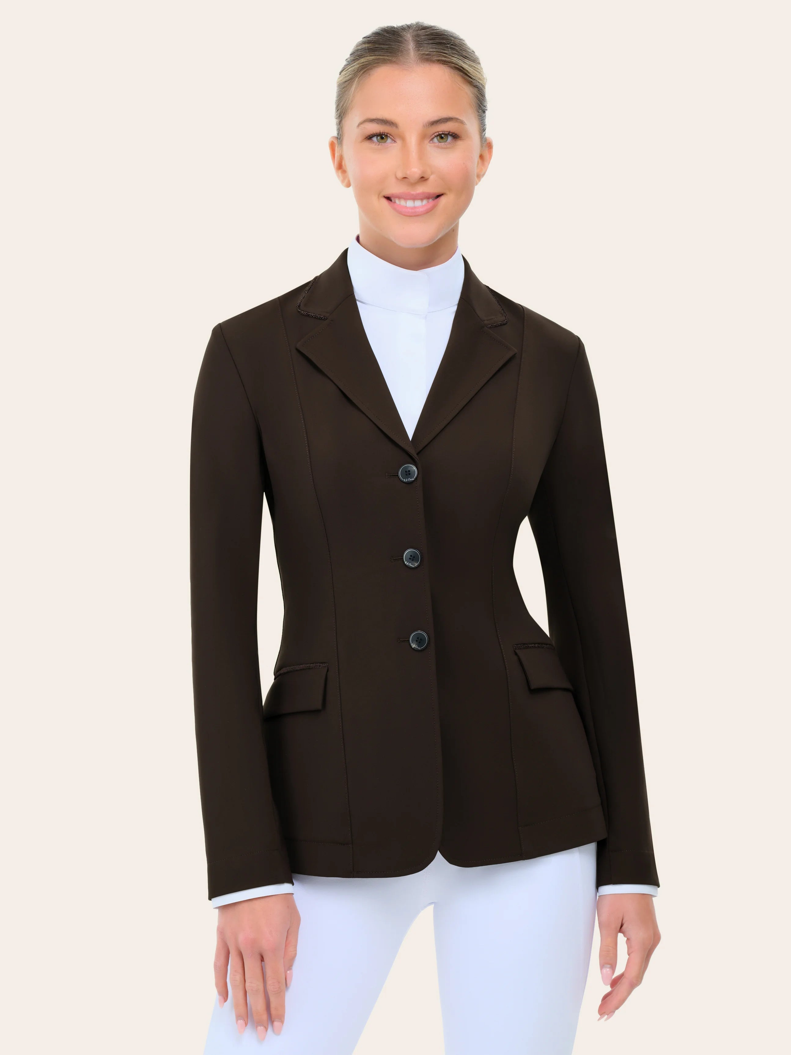 Front view of a female model wearing the chocolate RJ Classics Monterey Show Coat on a plain background