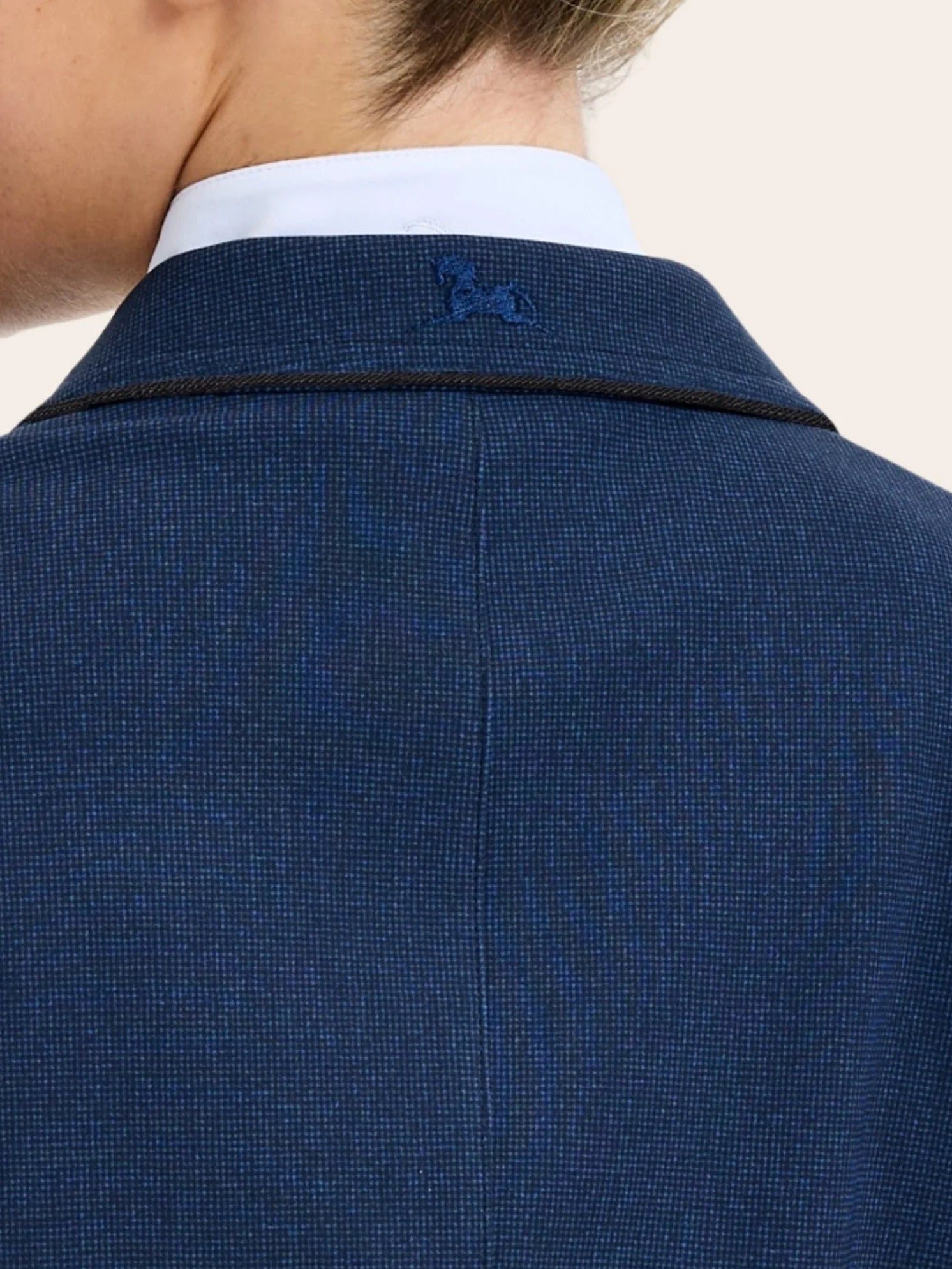 Close-up back view of a the collar on the twilight weave RJ Classics Monterey Show Coat on a plain background