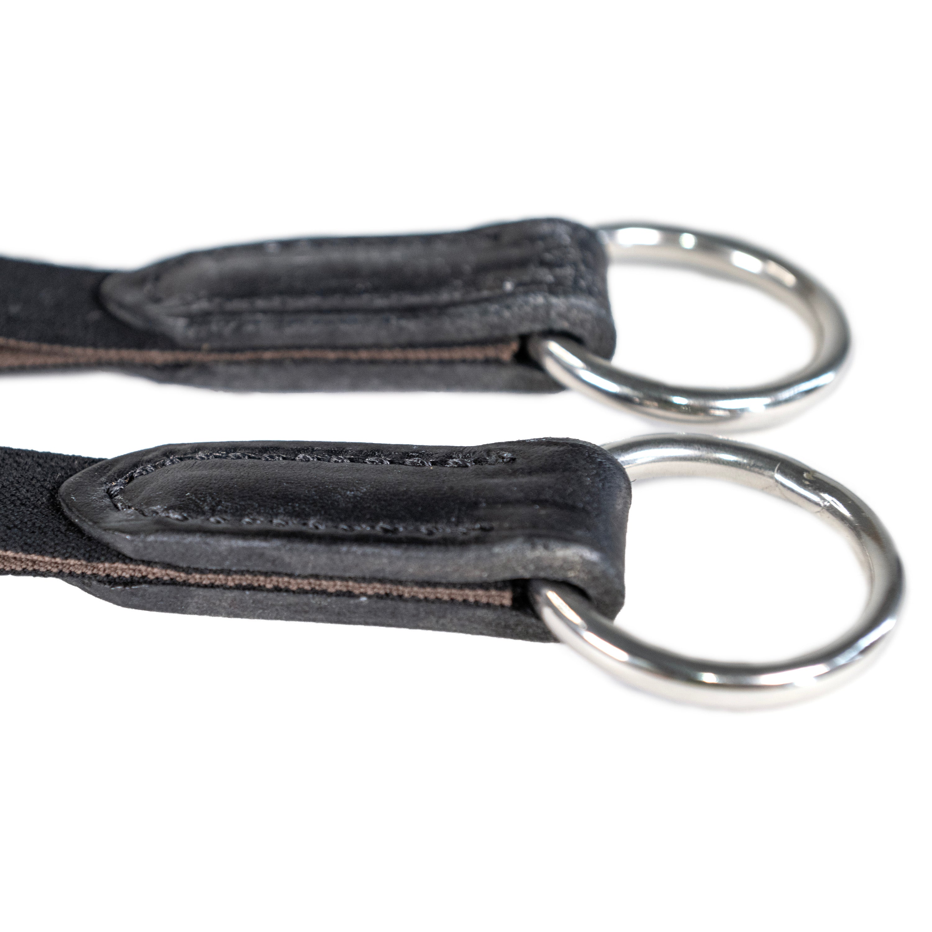 Close-up view of the black Nunn Finer Elastic Running Martingale Attachment on a plain background